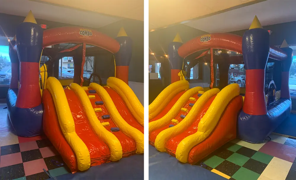 Inflatable bounce house with slides in the party room