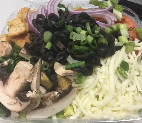 Salad with black olives, mushrooms, red onion and mozzarella